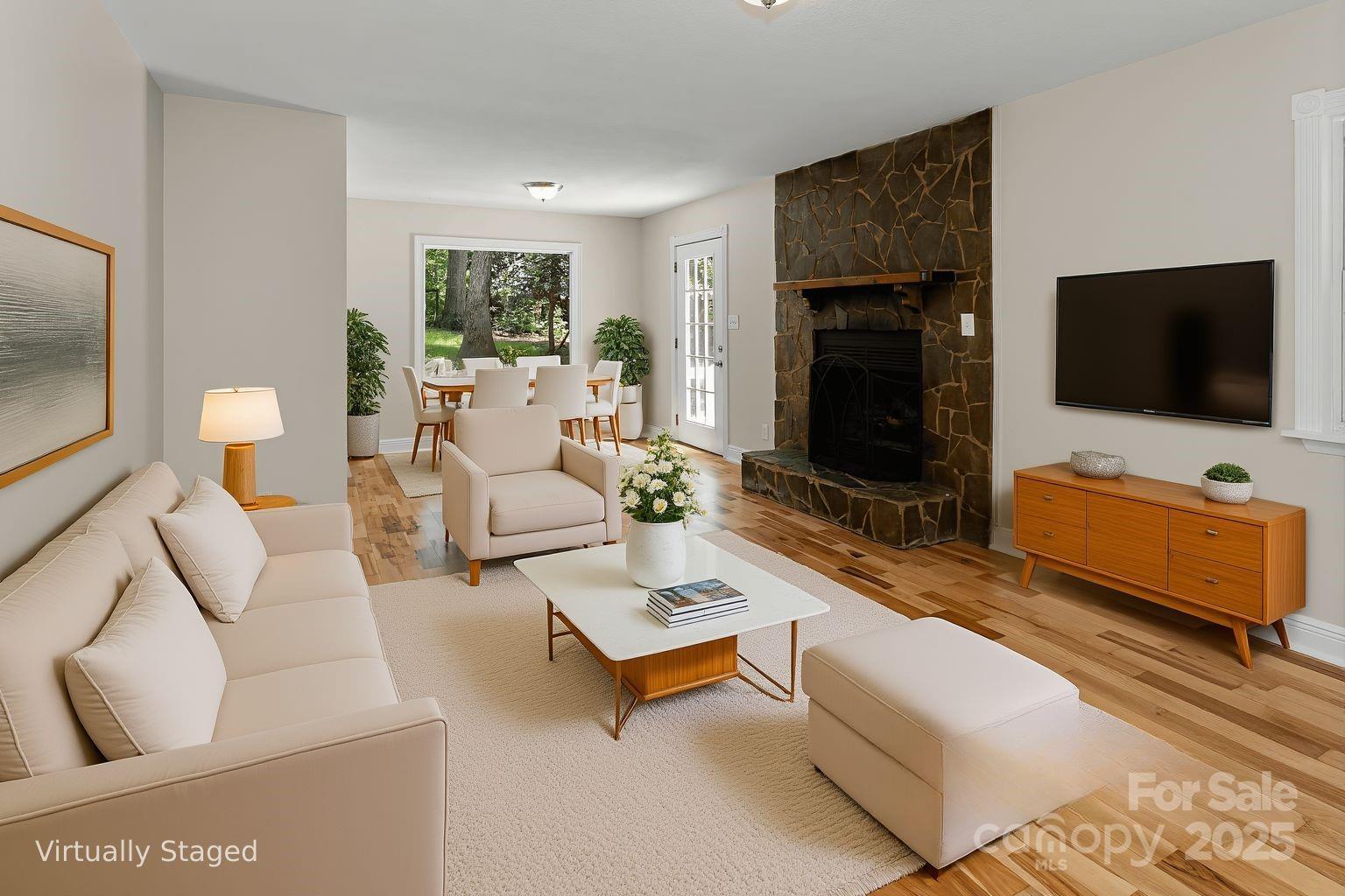 233 Youngs Cove Road Candler, NC 28715 - Photo 5 of 47 a living room with furniture and a flat screen tv