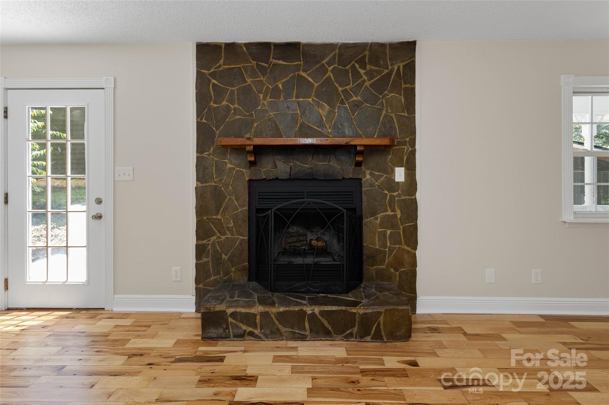 233 Youngs Cove Road Candler, NC 28715 - Photo 6 of 47 a living room with a fireplace