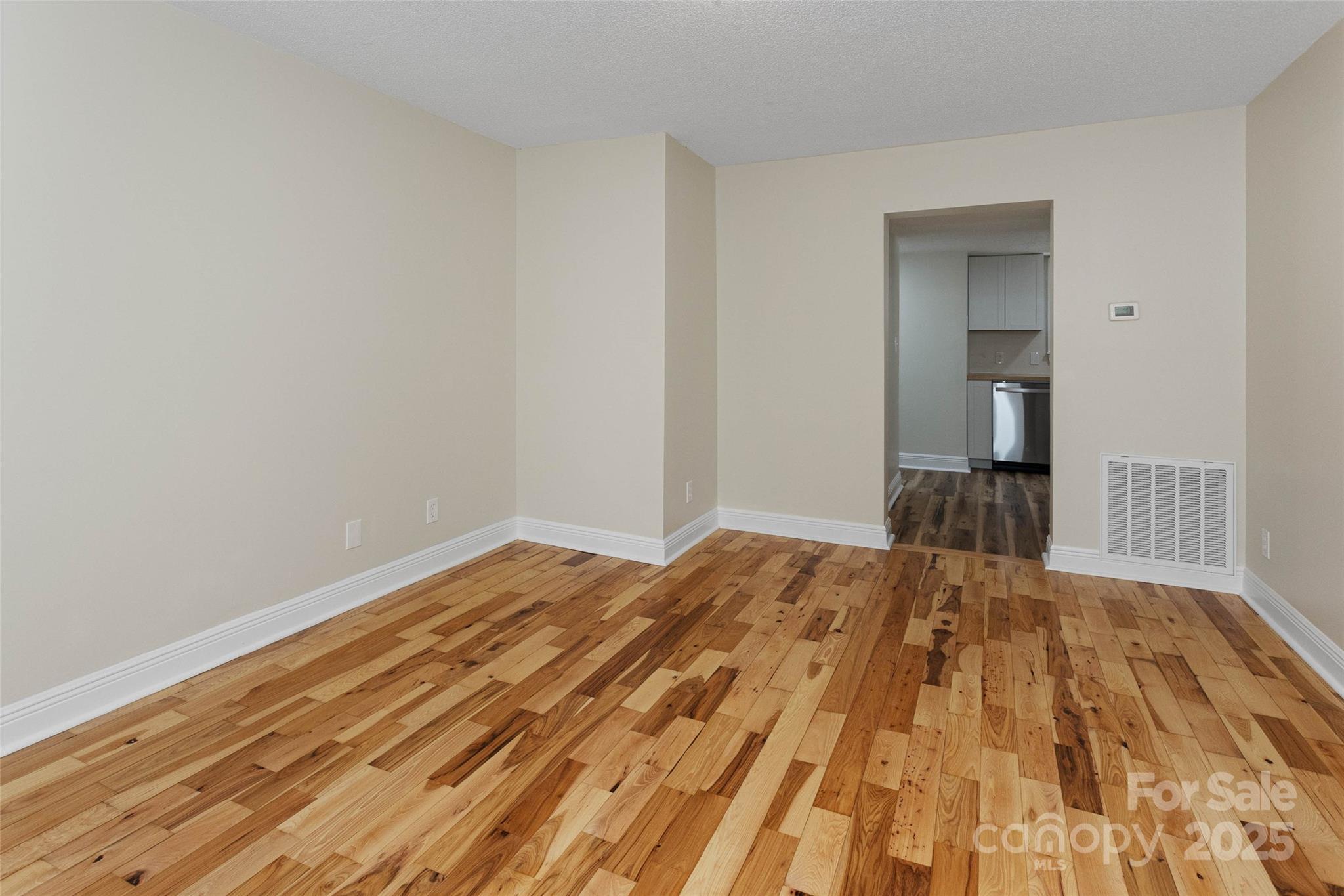 233 Youngs Cove Road Candler, NC 28715 - Photo 10 of 47 a bedroom with a bed and a mirror