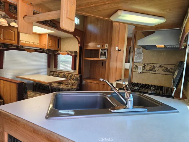 a living room with a couch and chandelier