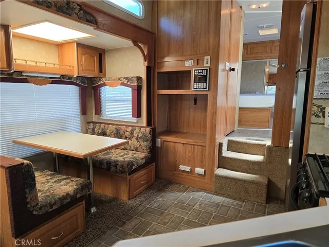 a view of a kitchen with furniture and a window
