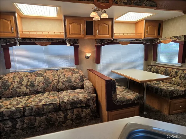 a view of a living room and entryway