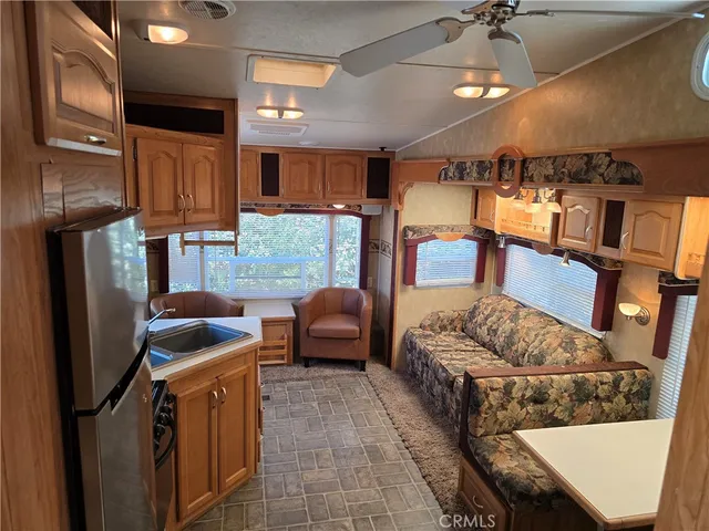 a kitchen with stainless steel appliances a stove a sink and a microwave