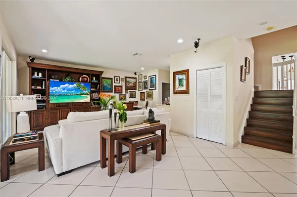 a living room with furniture and a flat screen tv