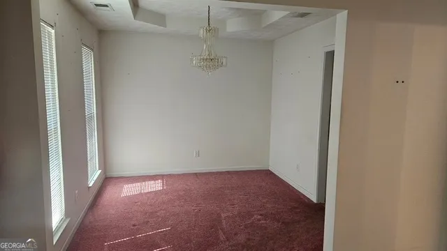 an empty room with a empty space and a window