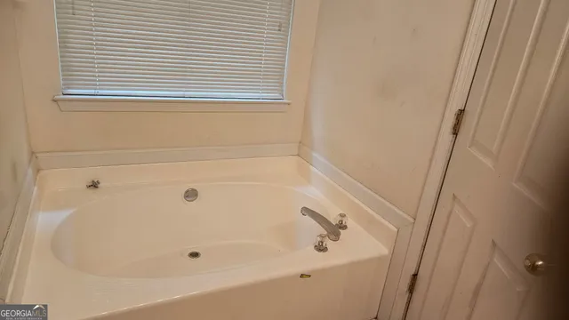 a bathroom with a bathtub