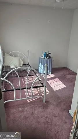 a view of a livingroom with furniture