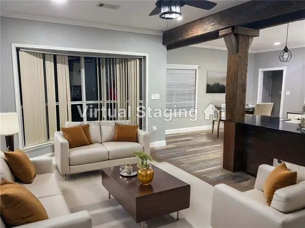 a view of empty room with wooden floor and ceiling fan