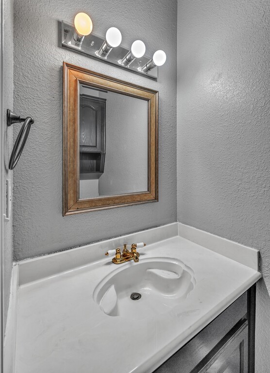 265 Wade Road Eddy, TX 76524 - Photo 29 of 71 a bathroom with a sink and a mirror