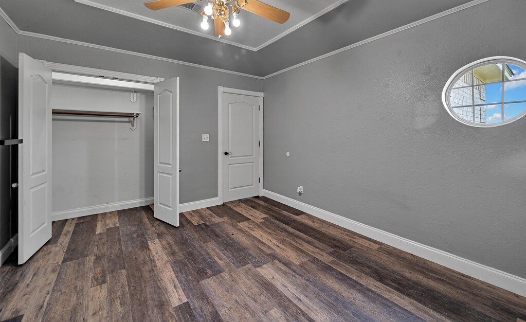 265 Wade Road Eddy, TX 76524 - Photo 40 of 71 a view of a room with wooden floor and white walls