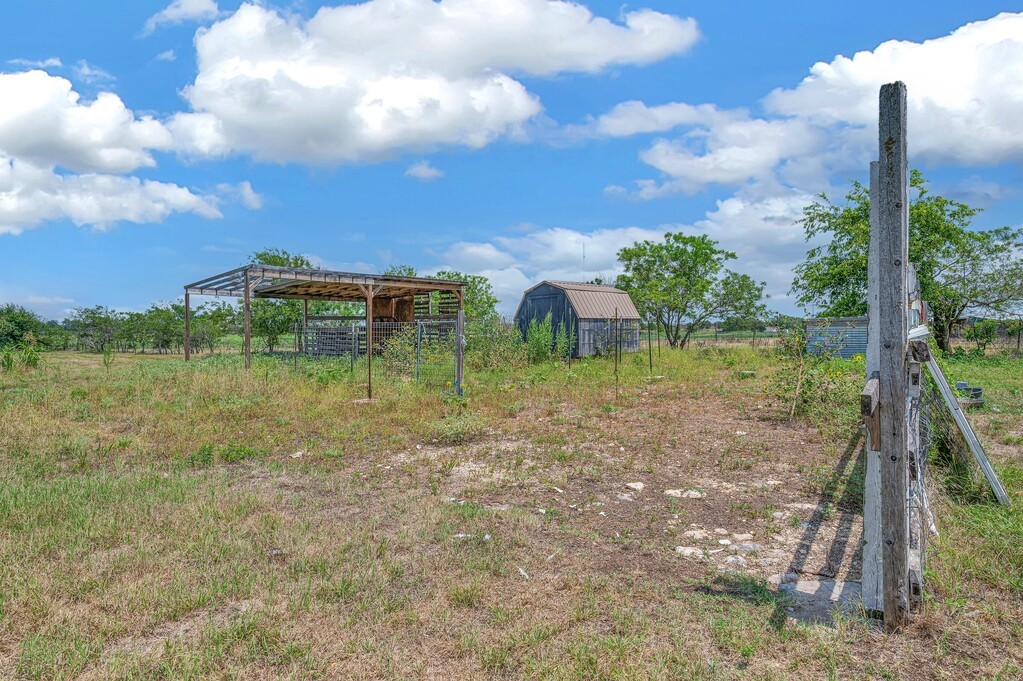 265 Wade Road Eddy, TX 76524 - Photo 58 of 71 a view of a lake with a big yard and potted plants