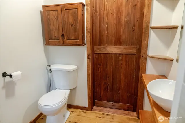 a bathroom with a toilet and a sink