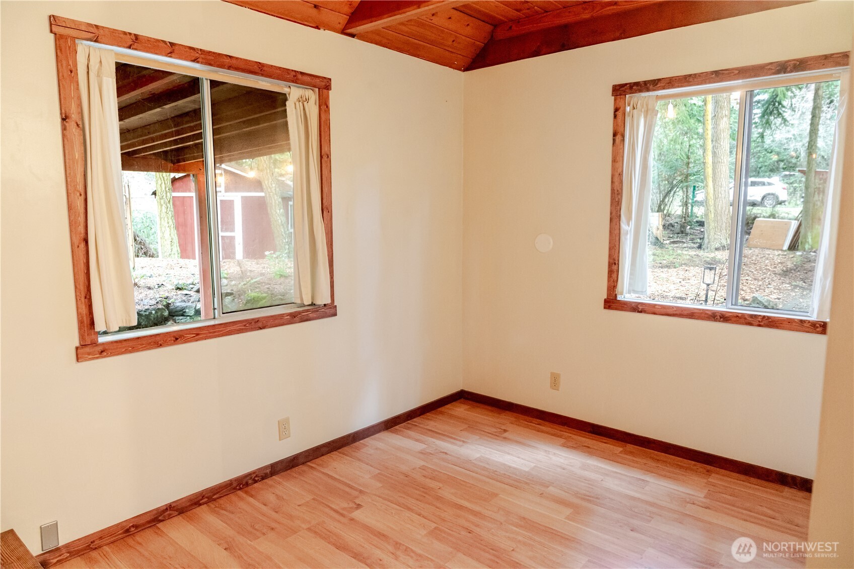 4533 South Discovery Road Port Townsend, WA 98368 - Photo 16 of 32 a view of empty room with wooden floor and fan