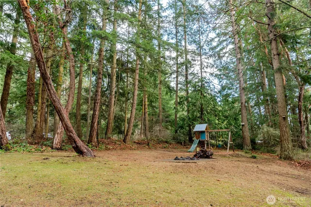 a view of a entertaining space with iron fence