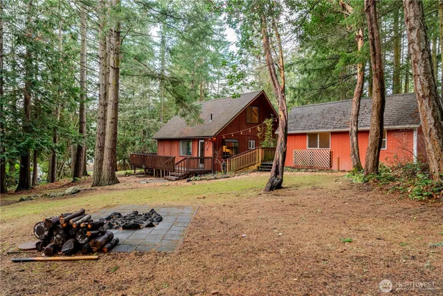 a view of a house with a yard covered in snow
