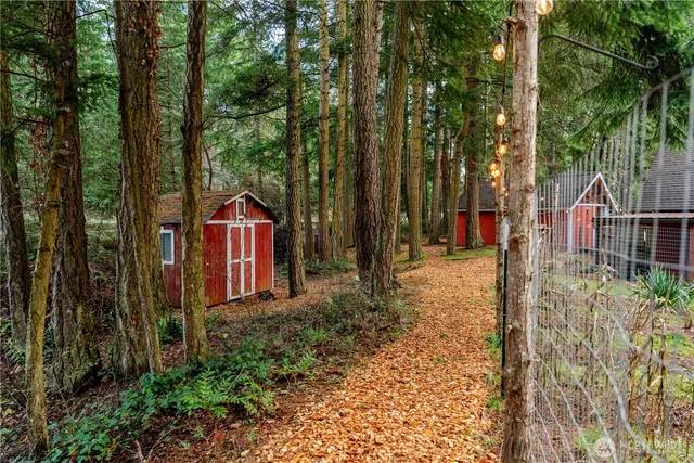 a backyard of a house with barbeque oven