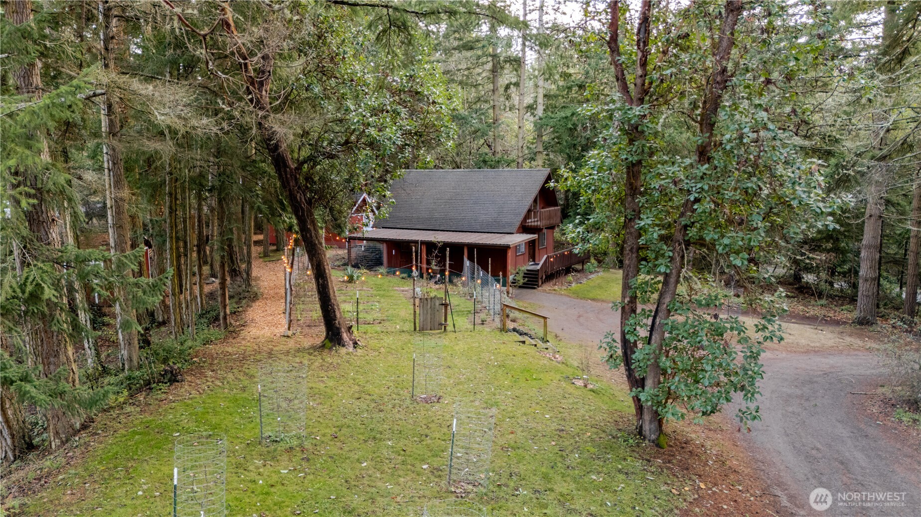 4533 South Discovery Road Port Townsend, WA 98368 - Photo 32 of 32 a view of house with backyard and sitting area