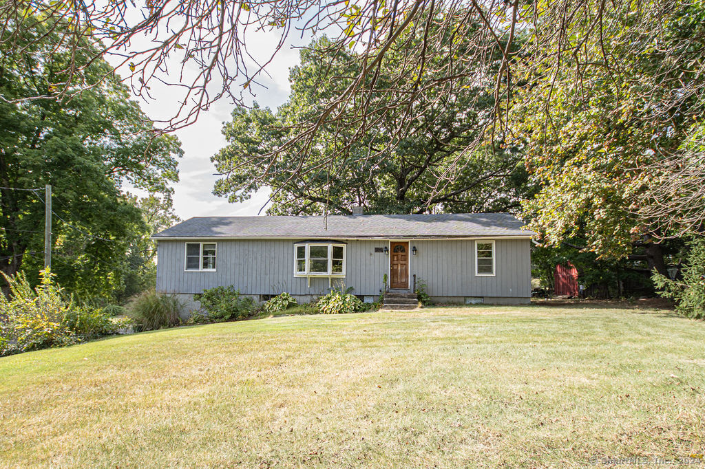394 Riverside Drive Thompson, CT 06255 - Photo 1 of 1 a view of a house with a yard