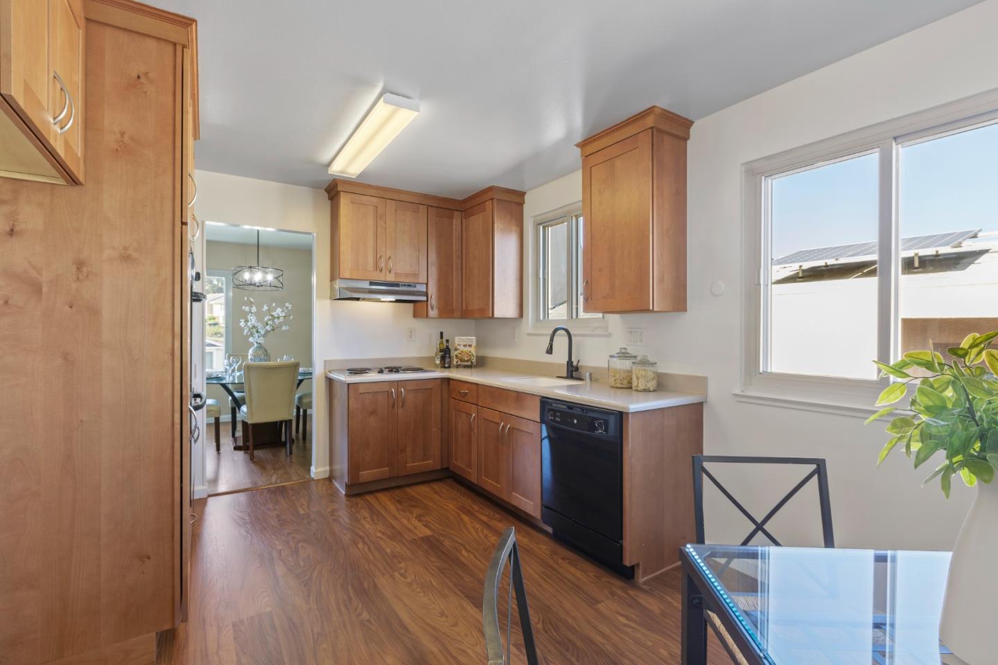 4366 Callan Boulevard Daly City, CA 94015 - Photo 12 of 38 a kitchen with a sink and wooden cabinets