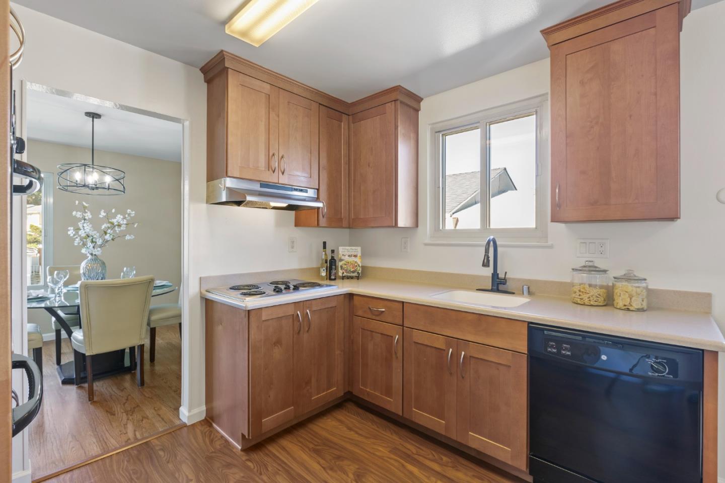 4366 Callan Boulevard Daly City, CA 94015 - Photo 14 of 38 a kitchen with a sink stove and cabinets