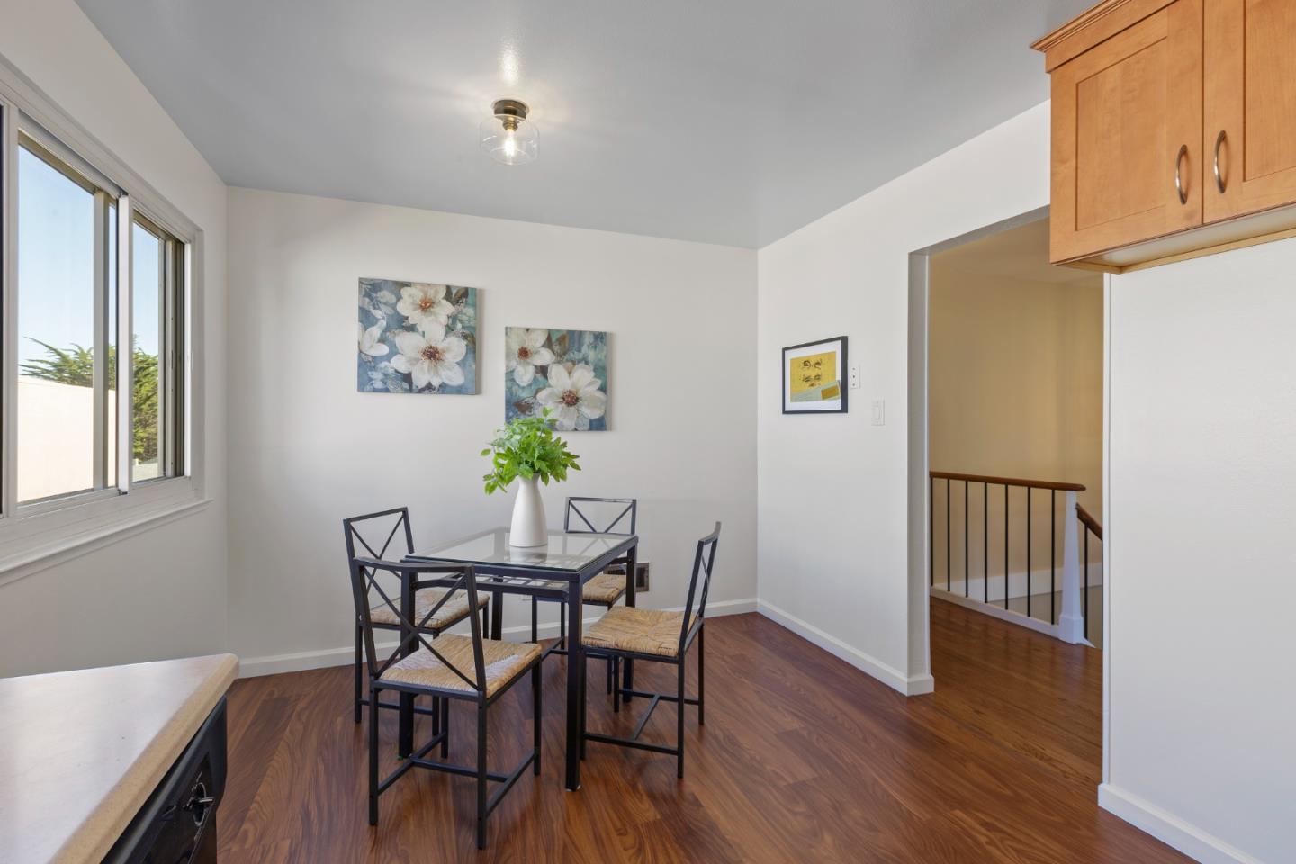 4366 Callan Boulevard Daly City, CA 94015 - Photo 17 of 38 a view of a dining room with furniture and wooden floor
