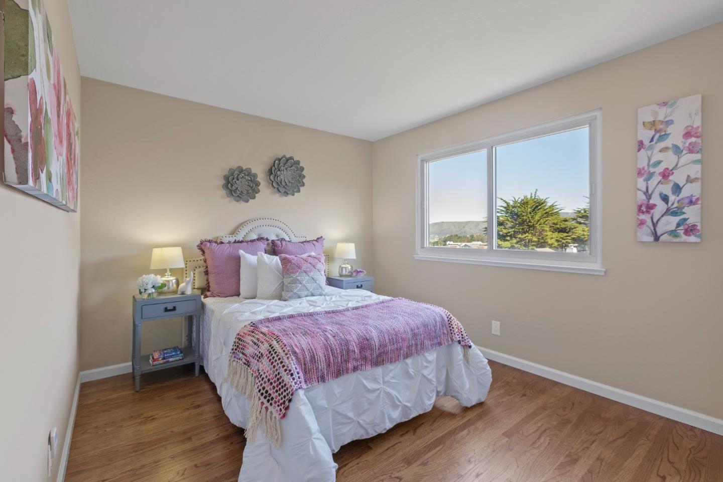 4366 Callan Boulevard Daly City, CA 94015 - Photo 19 of 38 a bedroom with a bed and painting on the wall