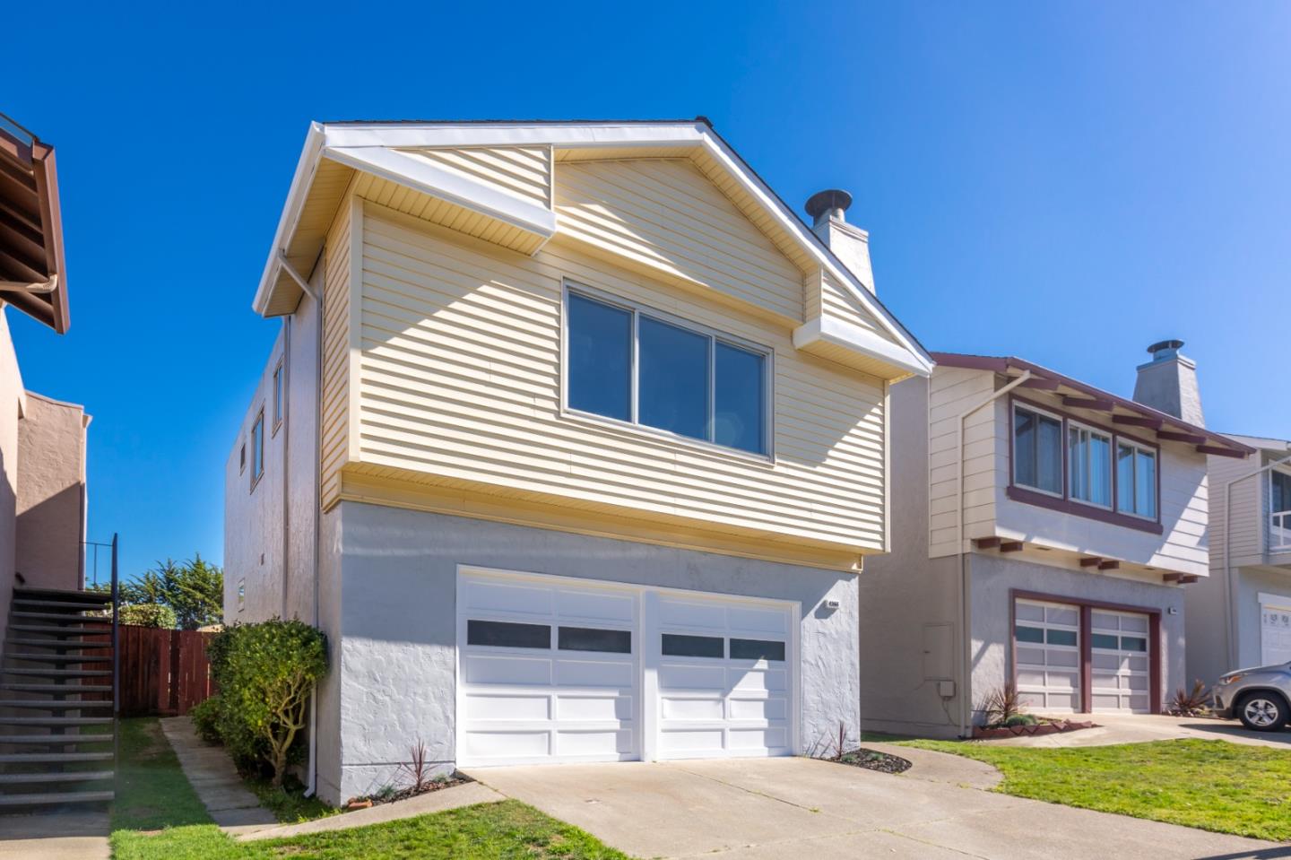 4366 Callan Boulevard Daly City, CA 94015 - Photo 2 of 38 a front view of a house with a yard