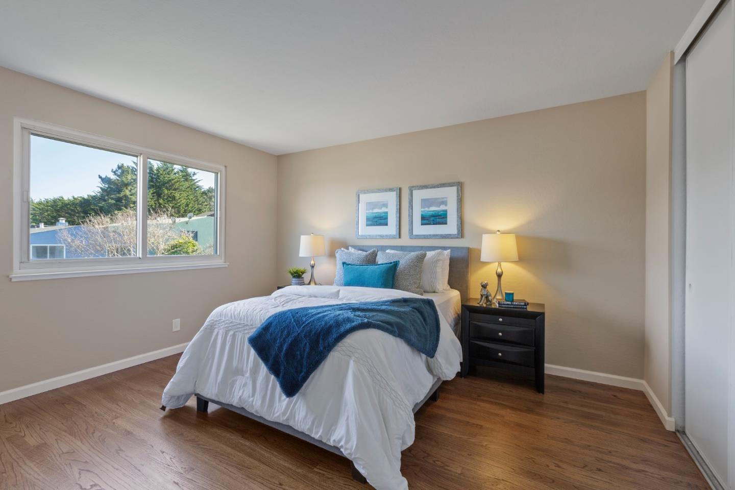 4366 Callan Boulevard Daly City, CA 94015 - Photo 21 of 38 a spacious bedroom with a bed and a window