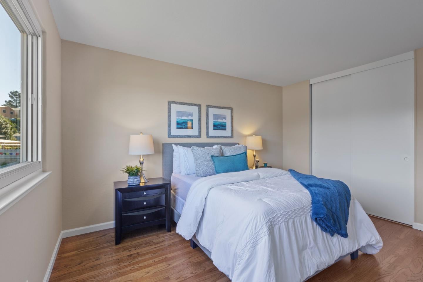 4366 Callan Boulevard Daly City, CA 94015 - Photo 22 of 38 a bedroom with a bed and lamps