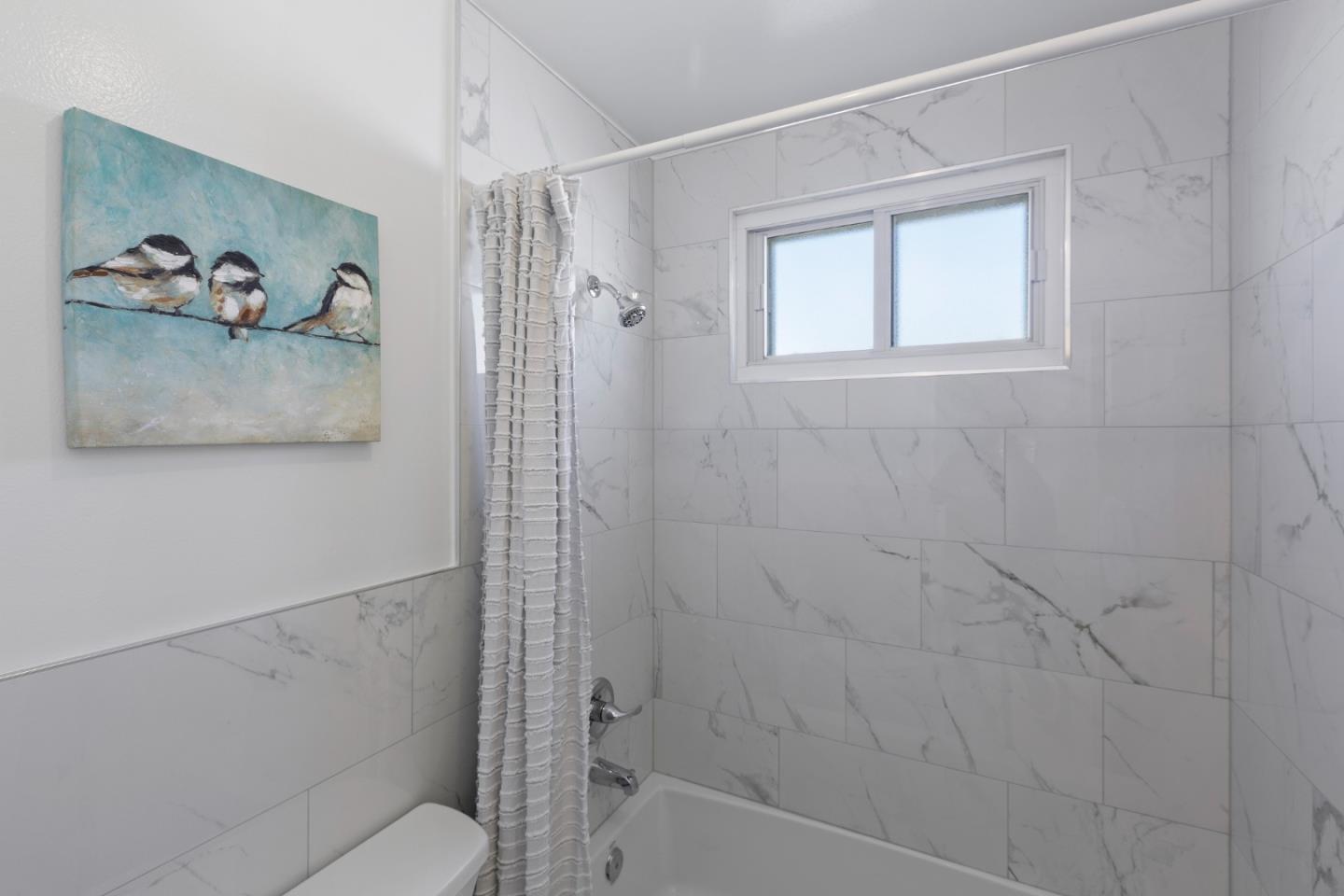 4366 Callan Boulevard Daly City, CA 94015 - Photo 24 of 38 a bathroom with a shower and a toilet