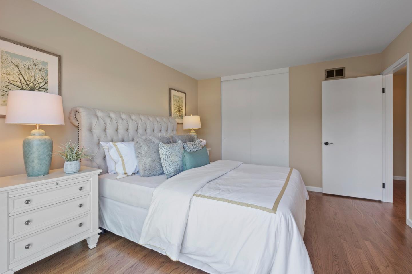 4366 Callan Boulevard Daly City, CA 94015 - Photo 26 of 38 a bedroom with a bed and a night stand