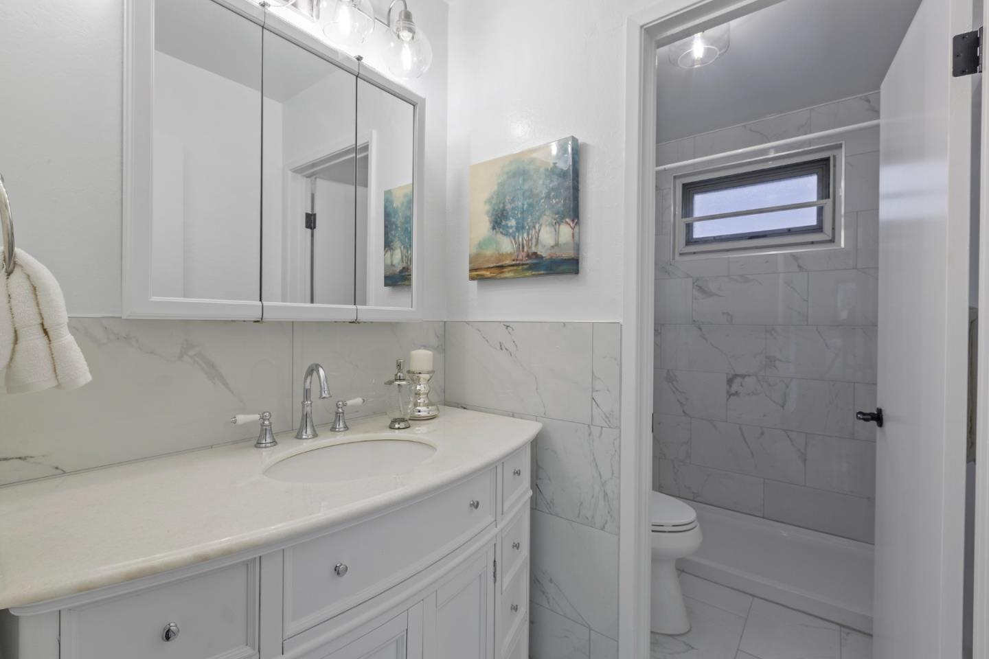 4366 Callan Boulevard Daly City, CA 94015 - Photo 29 of 38 a bathroom with a sink a toilet and shower