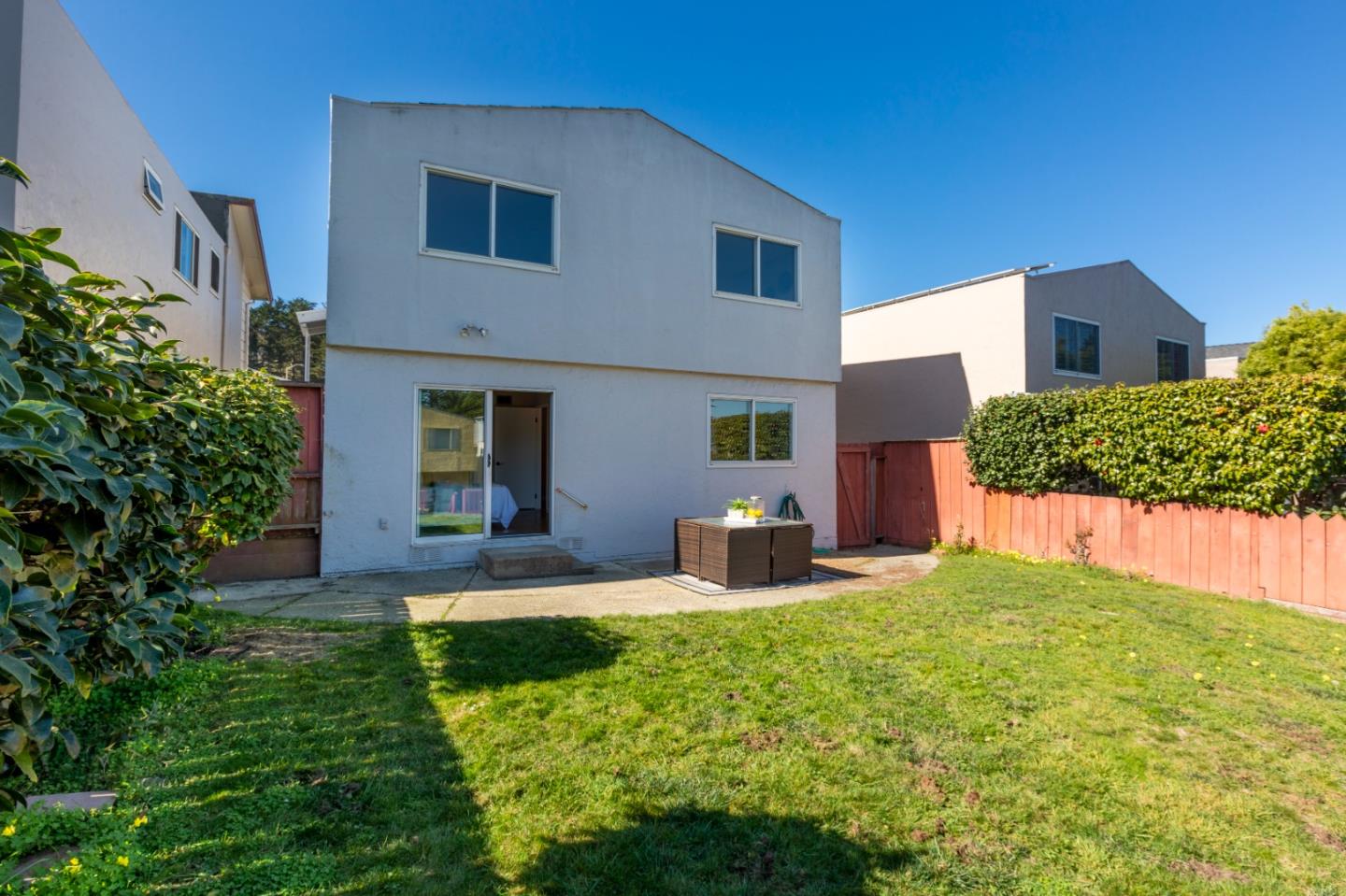 4366 Callan Boulevard Daly City, CA 94015 - Photo 34 of 38 a front view of a house with a yard and garage