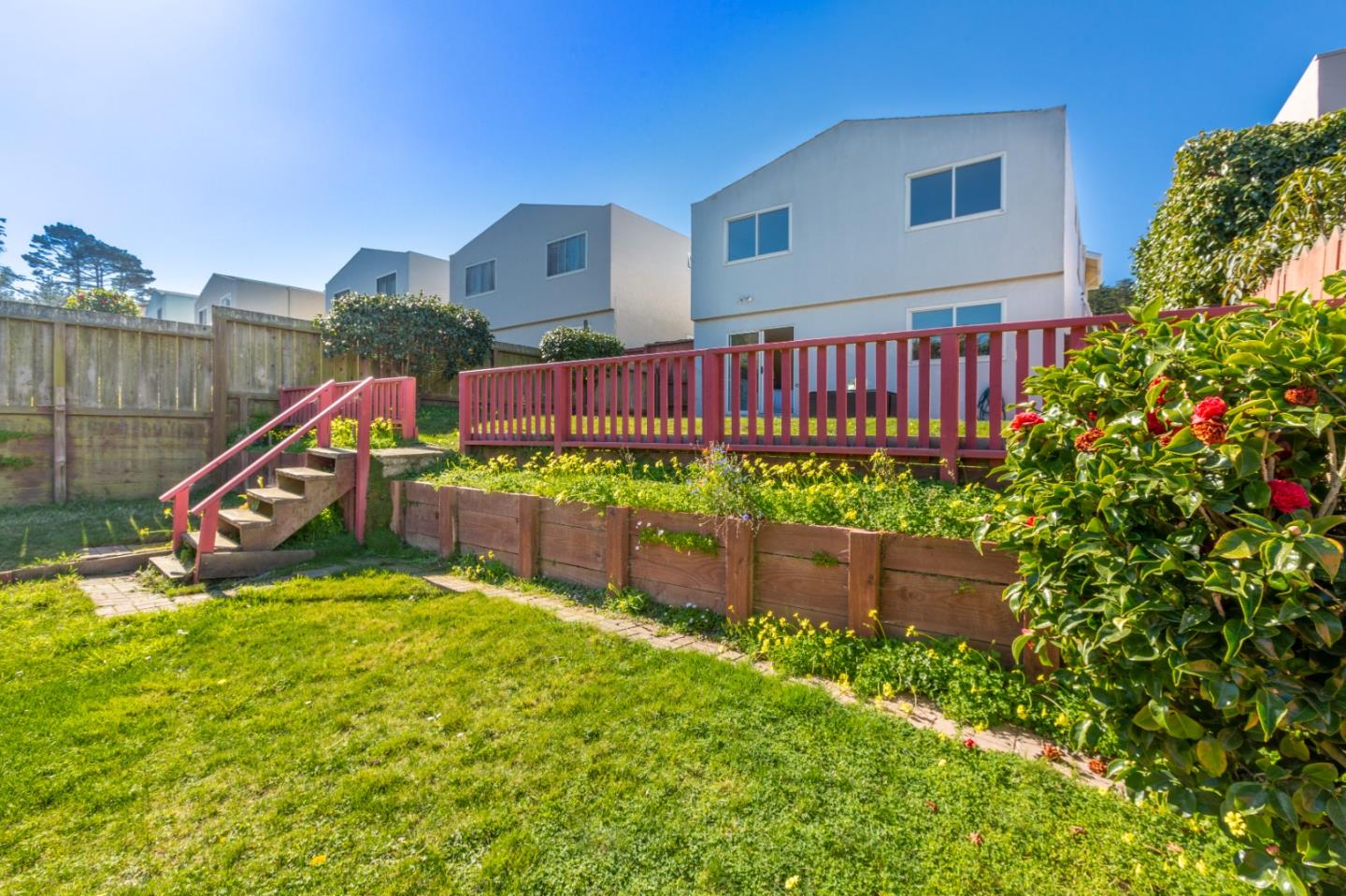 4366 Callan Boulevard Daly City, CA 94015 - Photo 36 of 38 a view of a house with a yard and a wooden fence