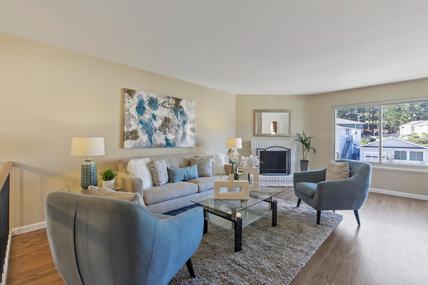 4366 Callan Boulevard Daly City, CA 94015 - Photo 6 of 38 a living room with furniture a rug and a fireplace
