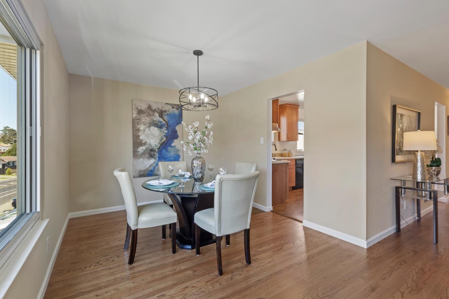 4366 Callan Boulevard Daly City, CA 94015 - Photo 10 of 38 a view of a dining room with furniture window and wooden floor