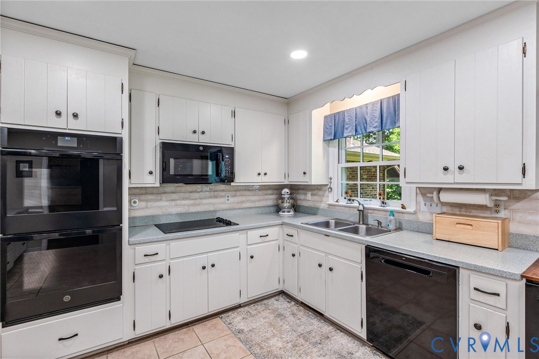 5700 Elfinwood Road Chester, VA 23831 - Photo 13 of 38 a kitchen with a sink stove and microwave