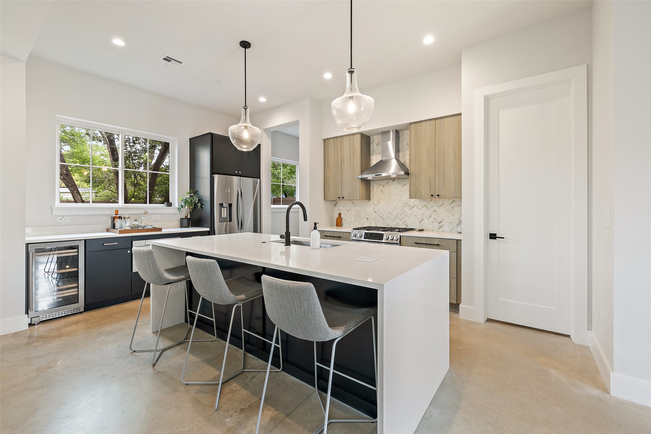 1504 Ruth Avenue, Unit 3 Austin, TX 78757 - Photo 9 of 39 A well-appointed kitchen features a central island, modern appliances, and generous counter space for culinary endeavors.