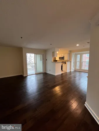 a view of a livingroom with wooden floor