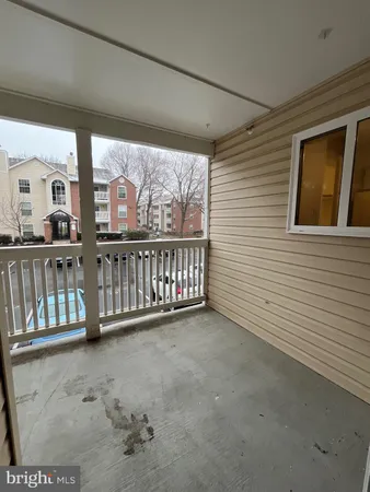a view of a porch with wooden floor
