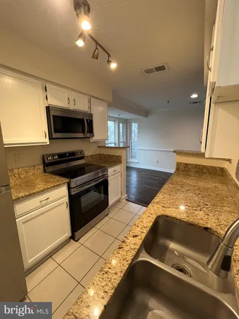 a kitchen with a stove and a microwave