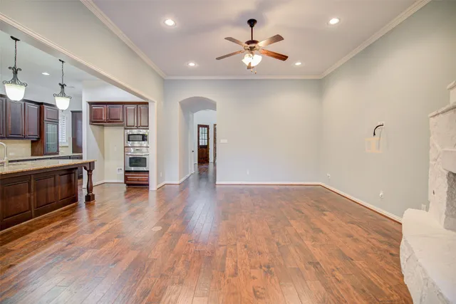 a view of a kitchen with a sink and a refrigerator