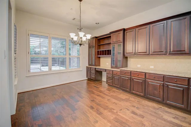a view of a kitchen with microwave and cabinets