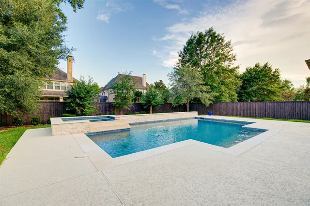 a view of a swimming pool with a patio