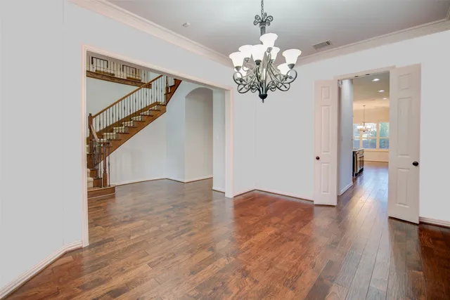 a view of an entryway with wooden floor