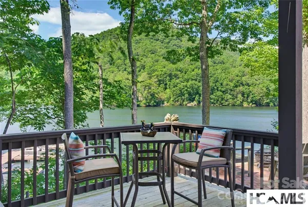 a view of a chairs and table in patio