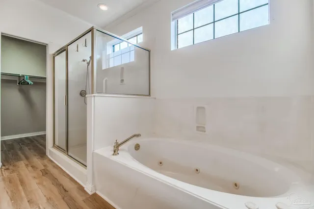 a bathroom with a bathtub and a shower