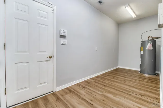 a view of a livingroom with a ceiling fan and window