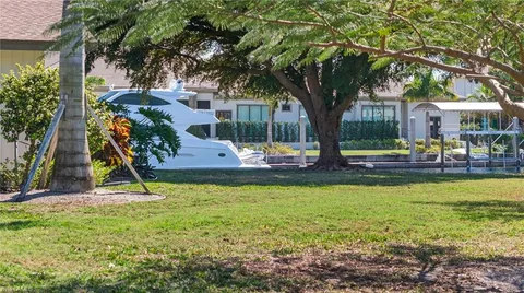 a view of outdoor space with garden and trees