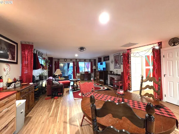a living room with furniture a rug and a flat screen tv